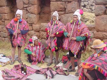 Peruvian Q'ero, playing flute in Despacho ceremony